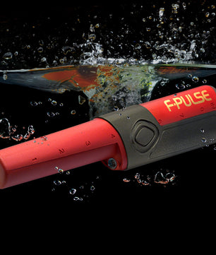 Fisher F-Pulse Pinpointer with pulse induction technology, waterproof design up to 6 feet, adjustable sensitivity, and a built-in LED flashlight, ideal for precise target location in all soil conditions.
